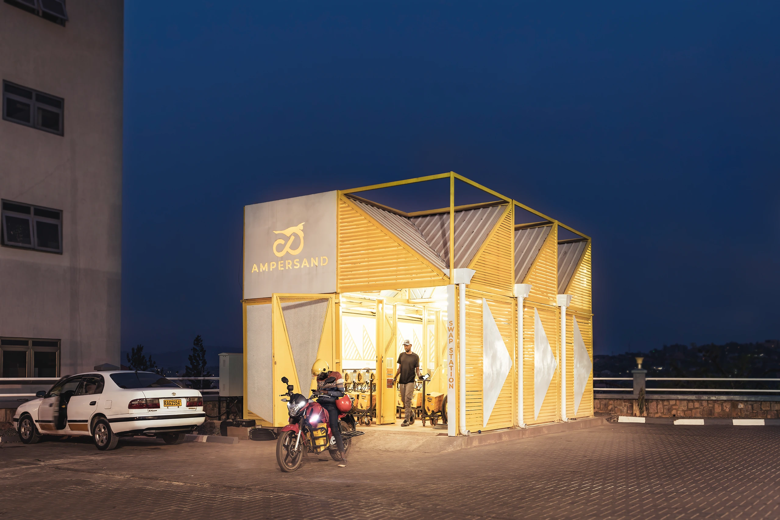A modular battery swap and charging station for electric motorcycles, conceived as the cornerstone of a regional e-mobility network in East Africa. Developed for a Rwandan mobility company, the station is adaptable, sustainable, and cost-efficient, designed to be rapidly assembled, dismantled, and relocated. Its prefabricated structure ensures compatibility with diverse terrains, climates, and business conditions, supporting expansion across Rwanda and Kenya. Beyond functionality, the design establishes a distinctive and recognizable identity that reinforces brand presence and attracts new users.