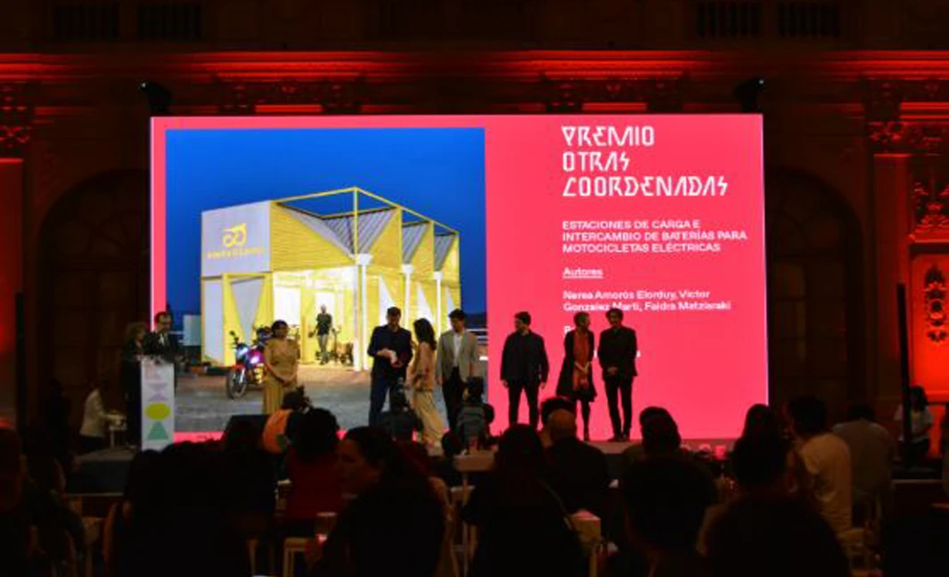 udience and speakers under modular yellow canopy at BIAU XIII architecture event in Lima.