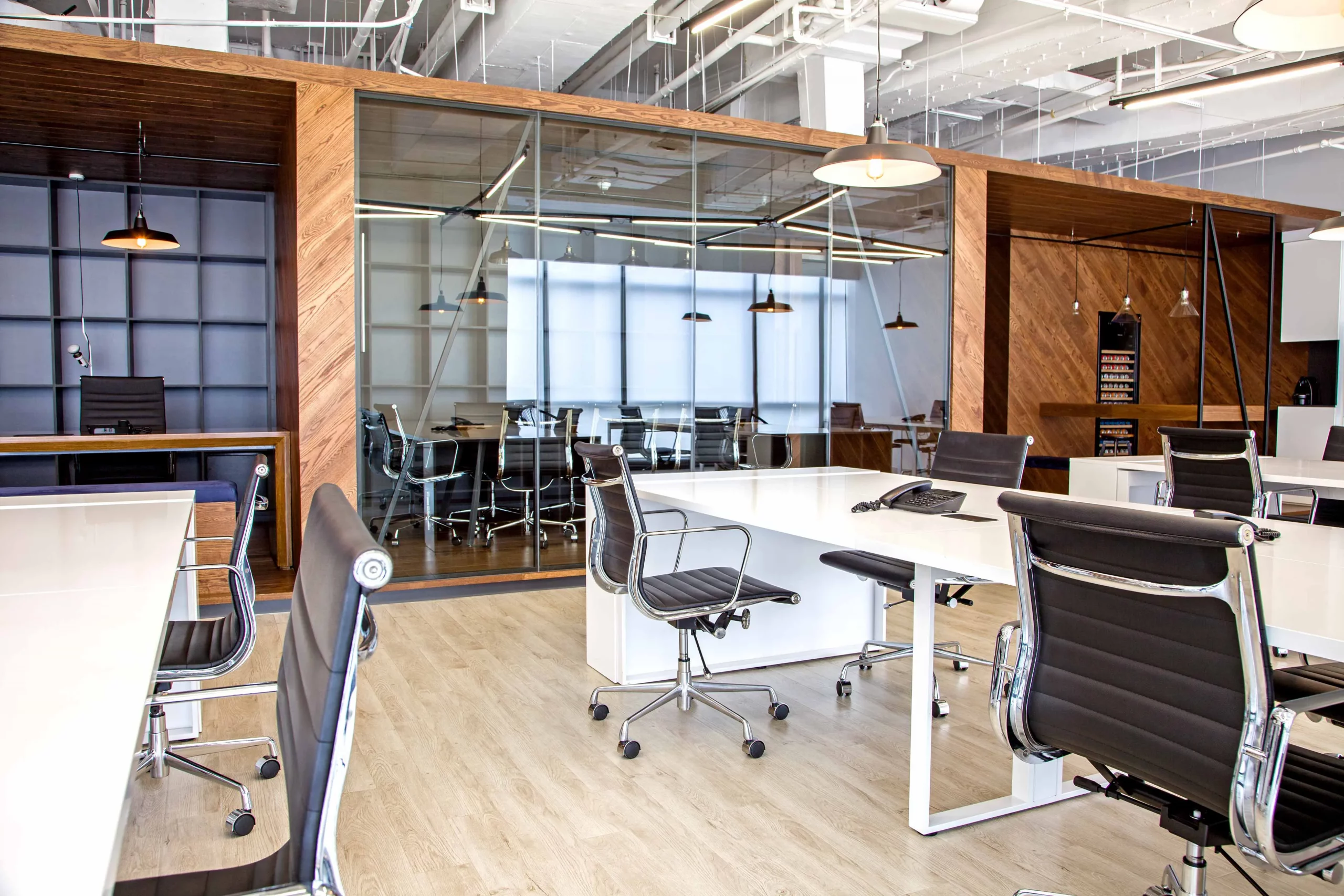 open workspace with glass partition and reused wood cassette structure at bpo office shanghai by cometa architects