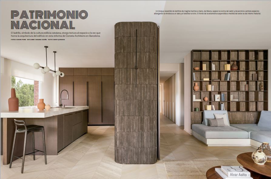 Barros Apartment by Cometa Architects in Barcelona, featuring a curved handcrafted brick core separating the kitchen and living room, photographed by Eugeni Pons. Option 2