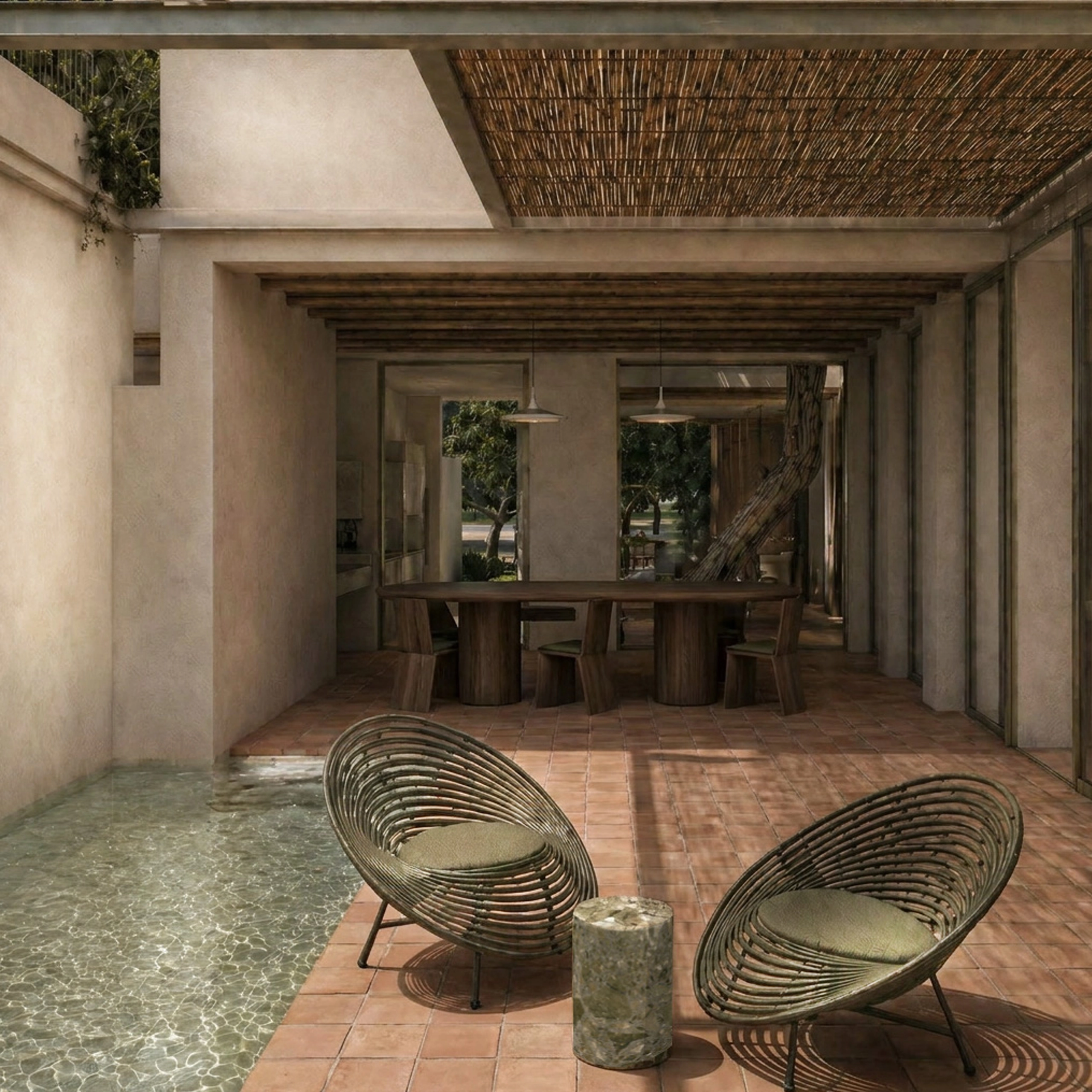 Pergola patio at Sa Capçada in Mallorca showing outdoor seating, terracotta paving, salt-water pool, shaded dining area, mineral walls and Mediterranean garden views.