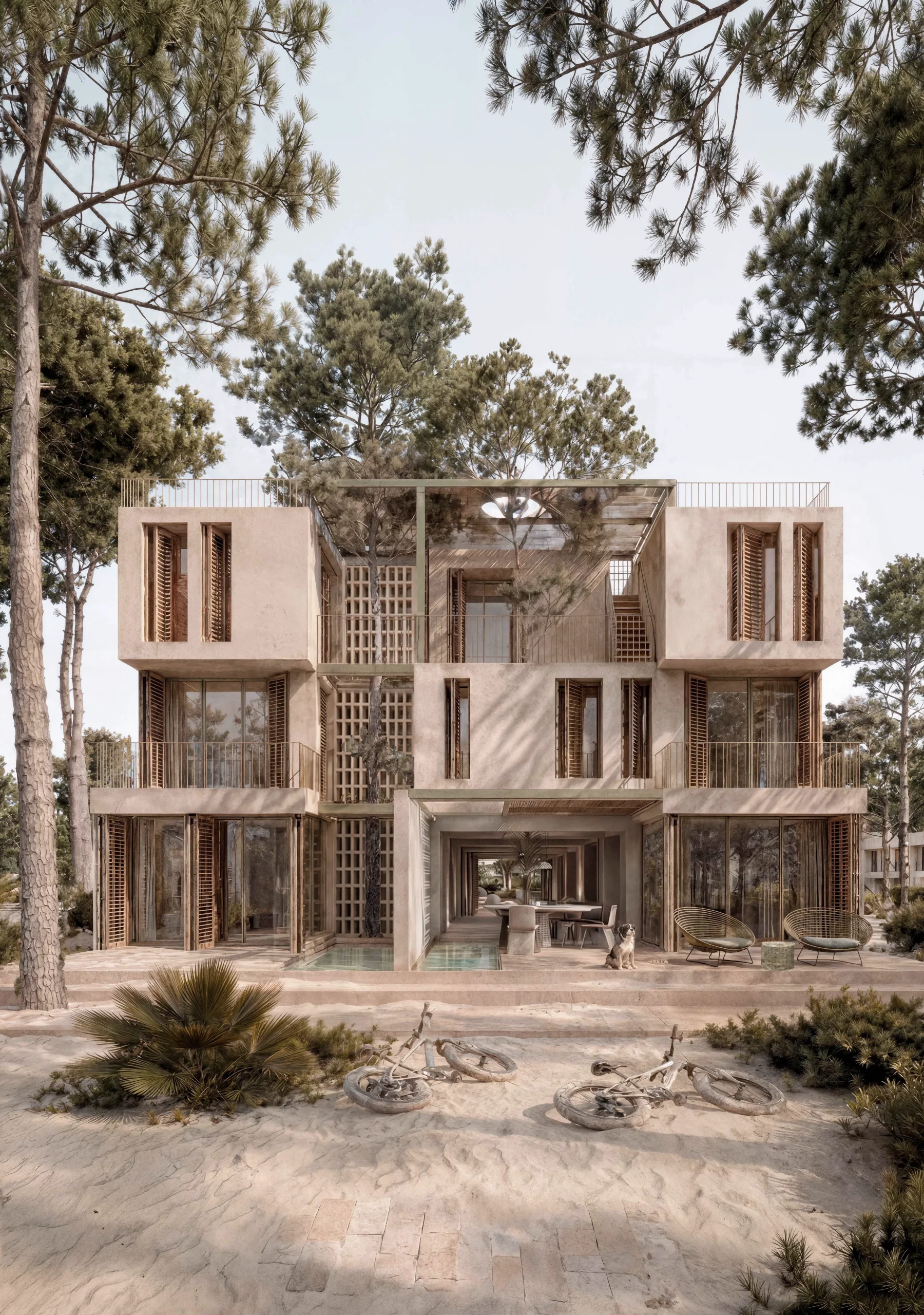 Front exterior view of Sa Capçada in Mallorca showing duplex homes with terraces, pine trees, sandy landscape, salt-water pools, pergolas and Mallorcan louvres.