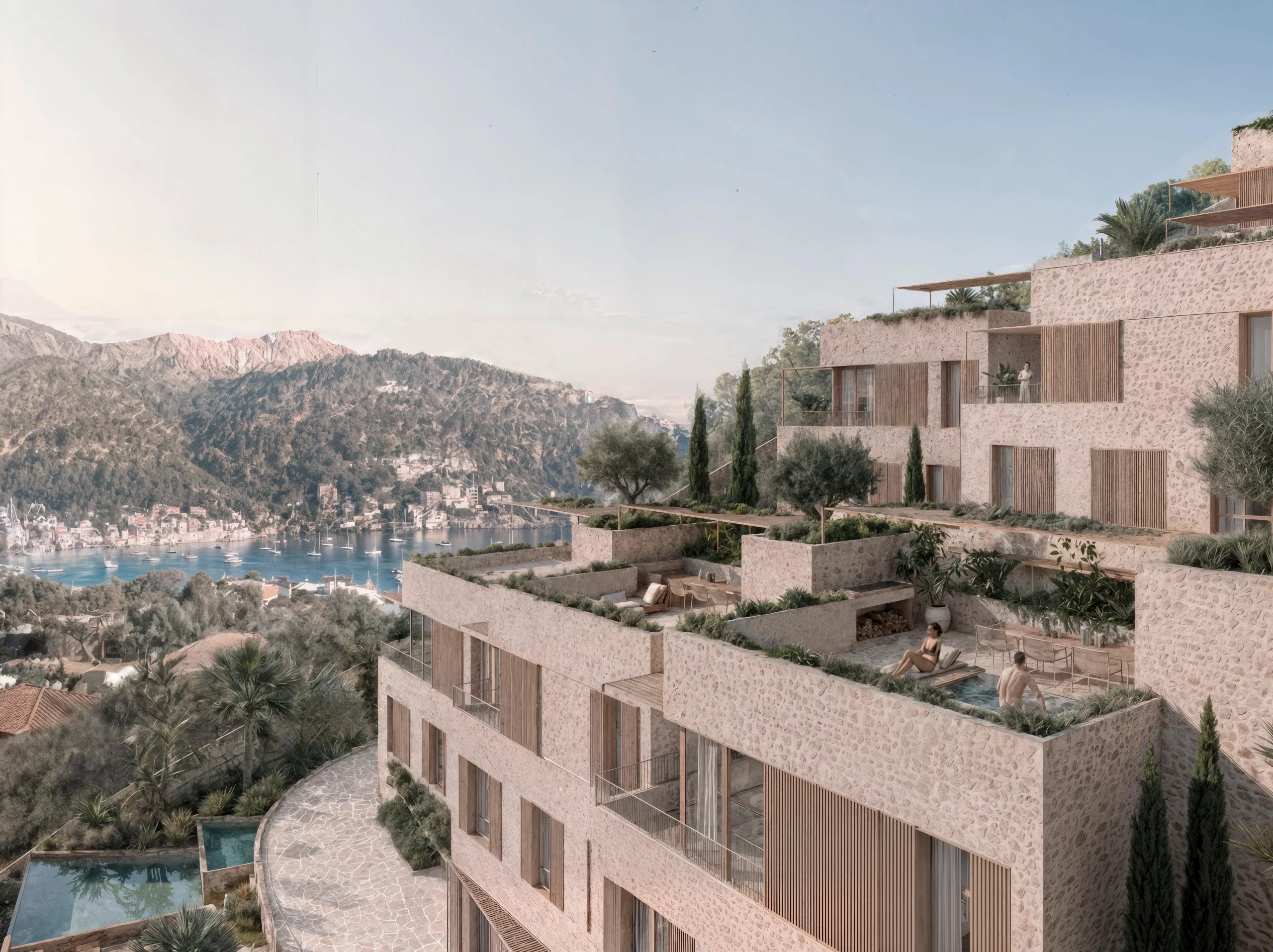 Exterior view of Salt d’Aigua by COMETA Architects, showing stepped stone villas, private terraces, swimming pools and Mediterranean landscaping overlooking Port d’Andratx harbour in Mallorca.