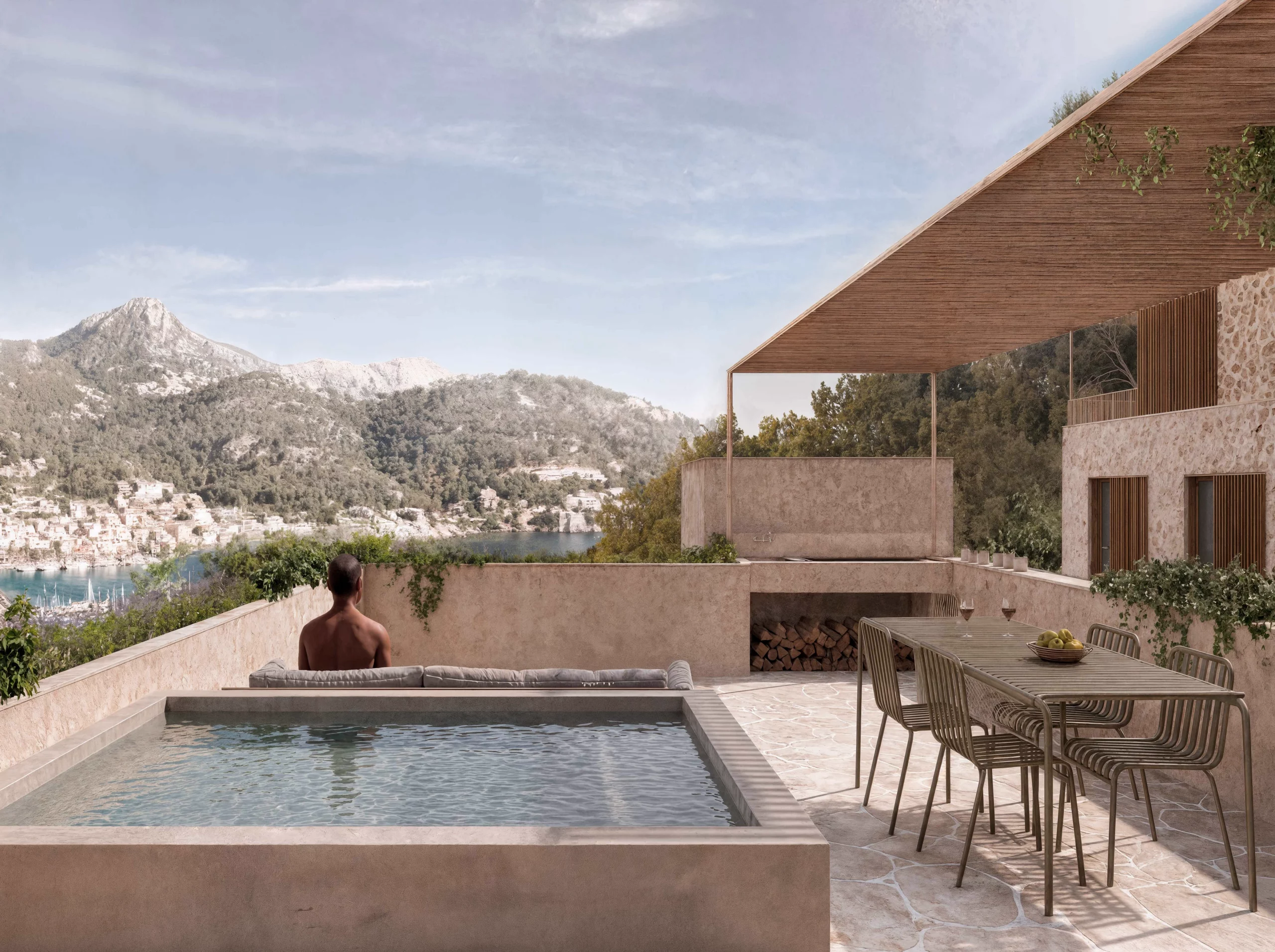 Private terrace at Salt d’Aigua by COMETA Architects, featuring a swimming pool, shaded outdoor dining area, integrated seating and panoramic views over Port d’Andratx, Mallorca.